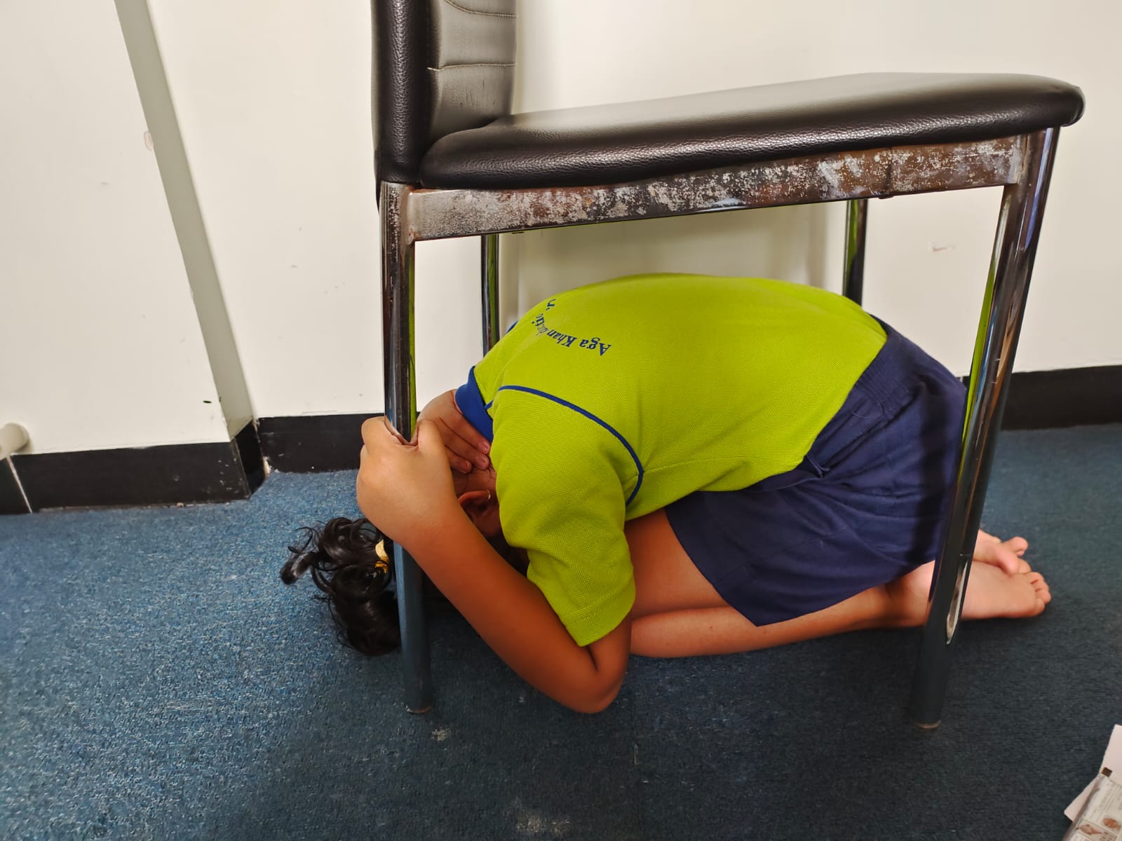 Picture of preschool children learning Drop, Cover and Hold On
