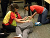 Members of the Emergency Response Team demonstrate how to assist a quake injured person.